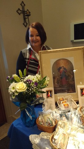 Picture of Linda at Rosary Table